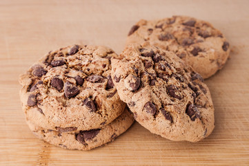 Chocolate cookies on wooden background