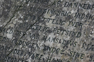 Gravestone with writing on it