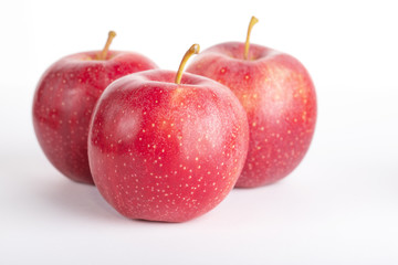 red ripe apples on a white background