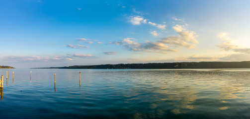 Germany, XXL panorama of reflecting clouds in water of lake constance at dawn