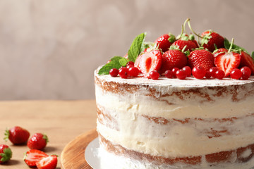 Delicious homemade cake with fresh berries on table, closeup