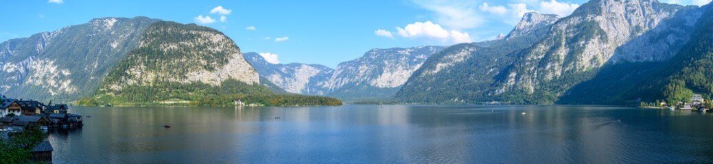 Fototapeta na wymiar Panoramic views of the Alpine lake and the town of Hallstatt, surrounded by mountains.