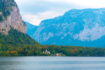 View of the Alpine lake and the town, surrounded by mountains.