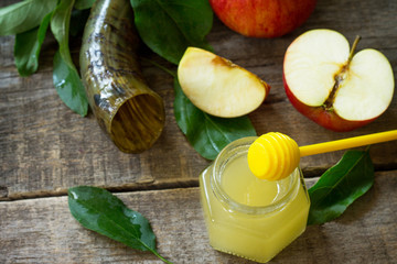 Background Rosh hashanah (Jewish New Year). Traditional holiday symbols - shofar, honey and apple...