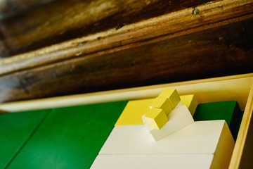 Boxes of pieces to learn geometry and to count in a classroom montessori