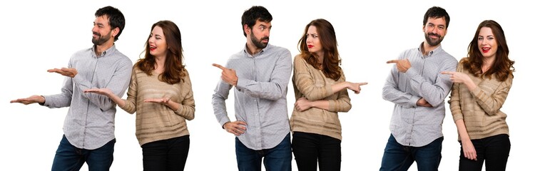 Set of Young couple pointing to the laterals having doubts