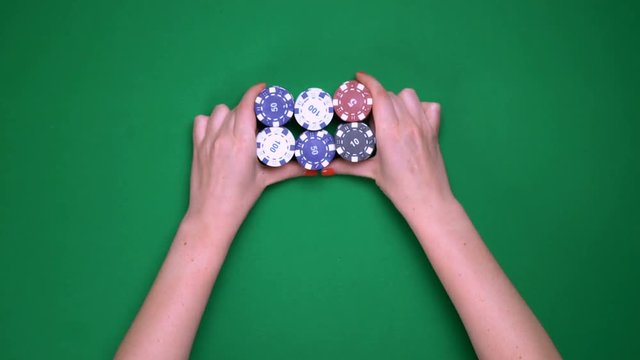 Female poker player going all-in, large bet, risky venture, gambling, top view. Serious game, all-in, gambling