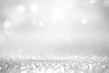 White silver glitter and grey lights bokeh with stars abstract background holiday.