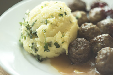 Mashed potatoes with meatballs.