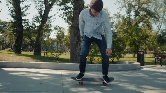Boy doing skateboard trick in skatepark, close up professional skater flip heelflip, 360 flip, varial kickflip, inward hardflip slow motion