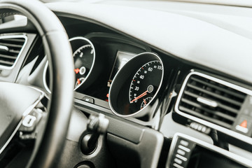 Fototapeta na wymiar Close up modern vehicle dashboard interior speedometer