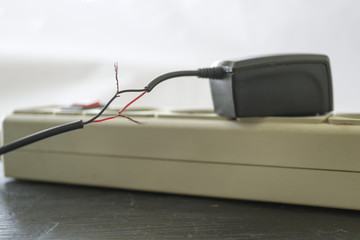 Charging for a smartphone with bare wires.