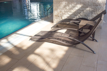 Empty pool, chaise lounges. Indoor swimming pool