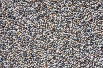Concrete wall with pebbles.