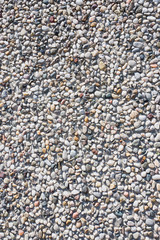 Concrete wall with pebbles.