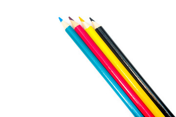 Four colored pencils. The colors cyan, magenta, yellow and black. The concept of polygraphy.