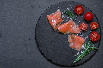 Fresh fish. Salmon fillet on black background. . food background. top view