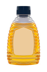 Plastic bottle with honey isolated on a white background