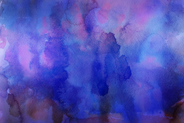 Colorful watercolor ombre leaks and splashes texture on white watercolor paper background. Natural organic shapes and design.