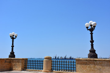 Italy, Puglia region, Taranto, street lamps for street lighting in the city and seafront.