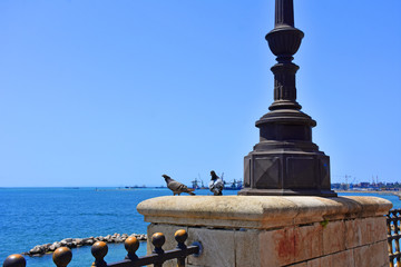 Italy, Puglia region, Taranto, street lamps for street lighting in the city and seafront.