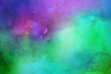 Colorful watercolor ombre leaks and splashes texture on white watercolor paper background. Natural organic shapes and design.