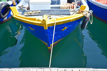 Italy, Puglia region, Taranto, boats and fishing boats moored or for maintenance. View and details.