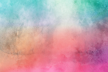 Colorful watercolor ombre leaks and splashes texture on white watercolor paper background. Natural organic shapes and design.