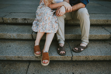 Couple holding hands on steps