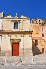 Fototapeta na wymiar Italy, Puglia region, Massafra, typical church in the historic center of the city. View of the facades.