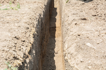 Providing safety for the installation of a new sewage pipe. Sewerage construction.
