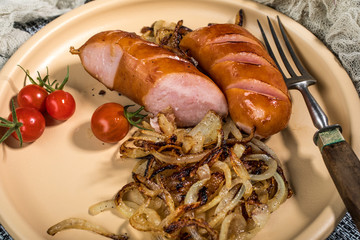 Fried sausage with onion.