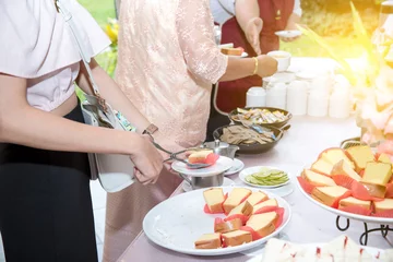 Foto op Canvas Food Buffet Catering Dining Eating Party Sharing Concept.people group catering buffet food indoor in luxury restaurant with meat colorful fruits and vegetables. coffee break. © kanpisut