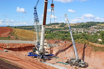 Crane lifting a bridge beam