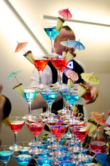 Glasses with cocktails made up in the form of a pyramid