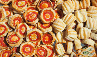 Mix of delicious appetizers and small pizzas made of puff pastry