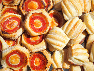 Mix of delicious appetizers and small pizzas made of puff pastry