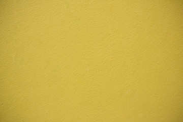 Yellow Concrete Wall Background.Concrete wall yellow color for texture background.Mustard rough concrete wall surface.