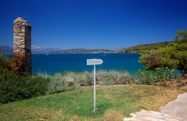 Travel Greece. To the beach sign. Spectacular view on one of the most beautiful beaches in Poros Island. Summer holiday