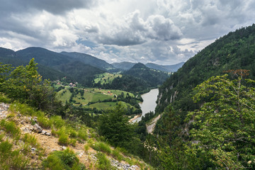 Fototapeta na wymiar Landscape view of Zaovine and Spajici lake from the height, and the river Beli Rzav in Tara national park in Serbia in summer day