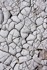 Texture, background of dry cracked earth ground. Global shortage of water on planet. Deep cracks in...