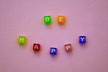the inscription on the cubes-be happy