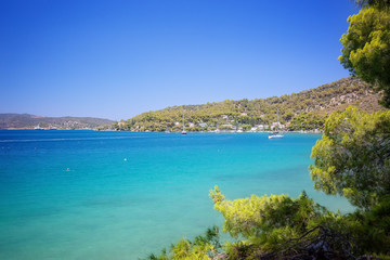 Fototapeta na wymiar Travel Greece. Spectacular view on one of the most beautiful beaches in Poros Island. Summer holiday