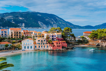 Beautiful panoramic view of Assos village with vivid colorful houses near blue turquoise colored...