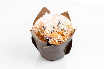 muffin cup cake closeup. With chocolate chips and fruit filling