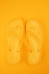 Stylish yellow flip flop sandals top view