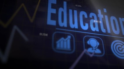 A Education business concept on a flashing computer monitor with moving graphs and data.