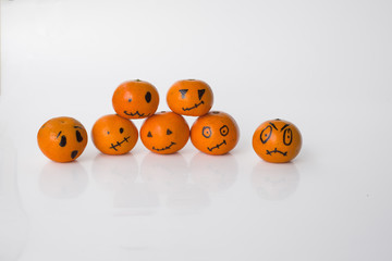 Horizontally background with seven tangerines pumpkins