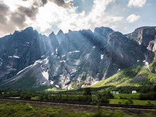 Fototapeta na wymiar Railroad in country landscape with mountains