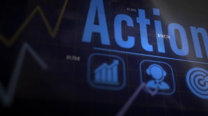 A Action business concept on a flashing computer monitor with moving graphs and data.